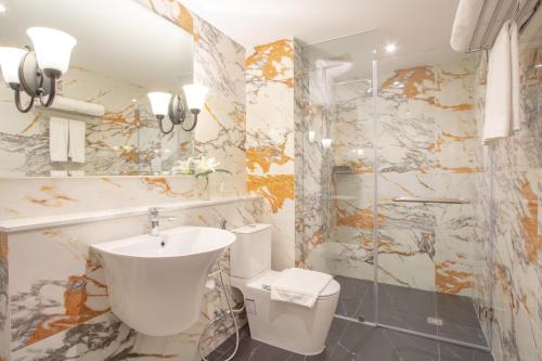 a bathroom with a sink and a toilet at Anantara Hua Hin Resort in Hua Hin