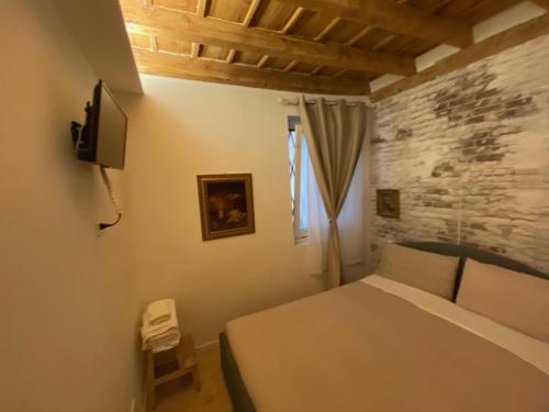 A bed or beds in a room at 30 San Gottardo House