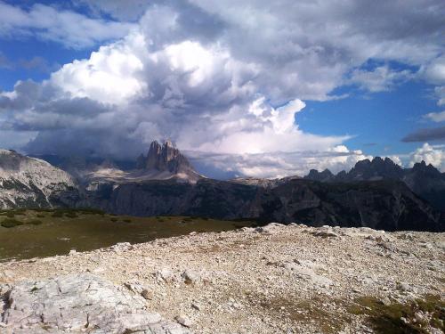 a view of a mountain under a cloudy sky at Appartments Helvetia in Villabassa