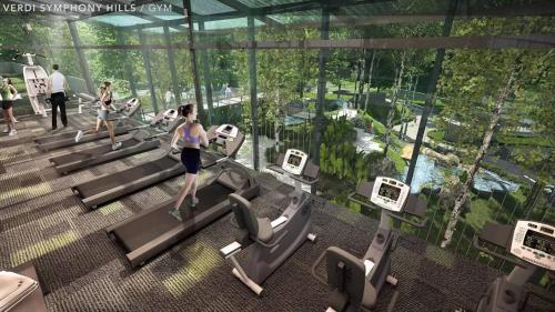a rendering of a gym with people on treadmills at Homestay Cyberjaya AC Home 4R3B Free Wifi Netflix in Cyberjaya