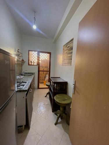 a kitchen with a counter and a table in it at Route de la jnane awrad lotissement 14 immeuble 5 étage 4 appartement 20 Marrakech in Marrakech