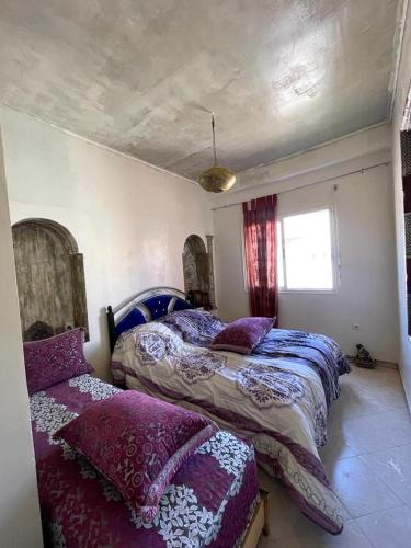 เตียงในห้องที่ Route de la jnane awrad lotissement 14 immeuble 5 étage 4 appartement 20 Marrakech