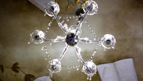 a glass snowflake chirstmas ornament on a table at Hotel Sant Roc in Solsona
