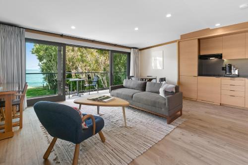 a living room with a couch and a table at SA Carbon Beach Suites in Malibu