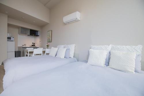 Una cama o camas en una habitación de The most comfortable and best choice for accommodation in Yoyogi SioY5
