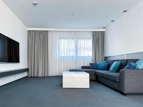 a living room with a couch and a tv at ShareBnB in Tobit.Town in Ahaus