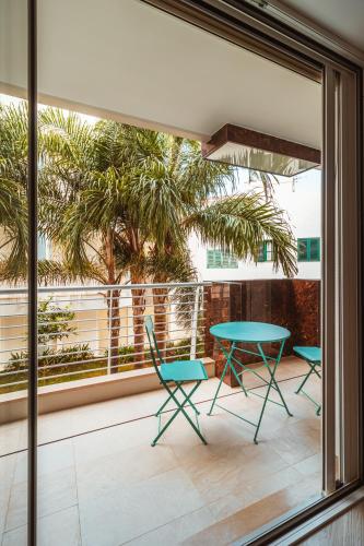 a patio with a table and chairs on a balcony at VL Luxury Apartment - Housea in Polignano a Mare