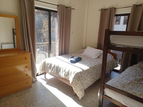 a bedroom with a bed and a window at Galata's Bridge Hotel in Galata