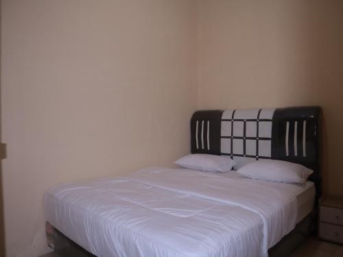 Ένα ή περισσότερα κρεβάτια σε δωμάτιο στο Tendy Guest House