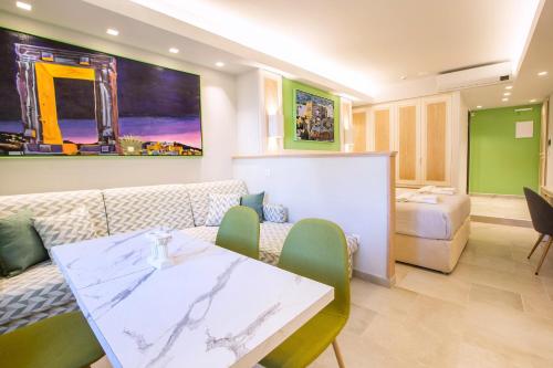 a living room with a couch and a table at Mariet Athens Boutique Spa in Athens