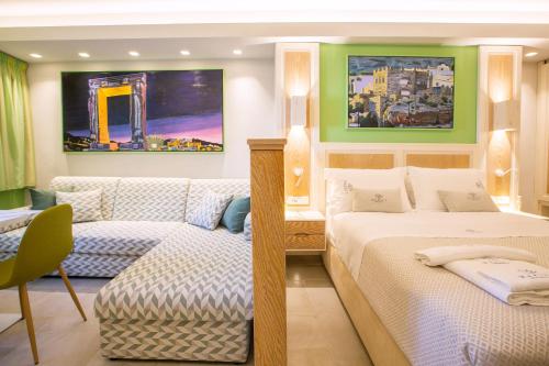 a bedroom with two beds and a couch at Mariet Athens Boutique Spa in Athens