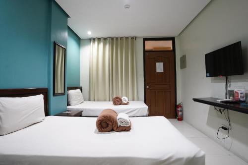 Llit o llits en una habitació de Arzo Hotel Grand Lodge