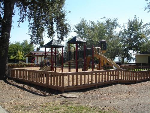 a playground with a slide in a park at Lakeview Inn in Lucerne
