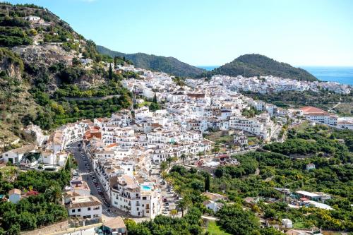 an aerial view of a town on a mountain at Villa Las Palomas con piscina privada by At Home Costa del Sol in Torrox