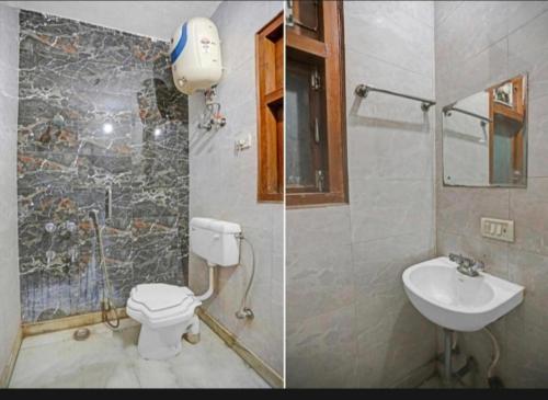 a bathroom with a toilet and a sink at The Super Residency in New Delhi