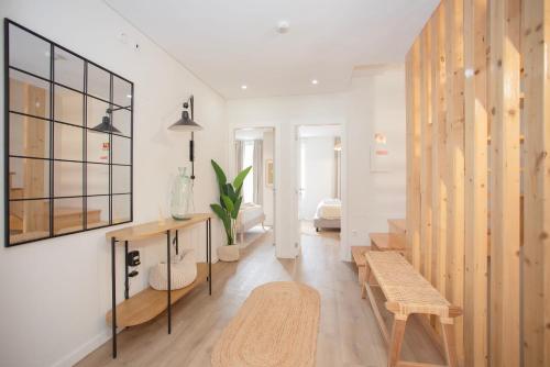a living room with a bench and a table at Liiiving in Porto - Downtown Quiet House in Porto