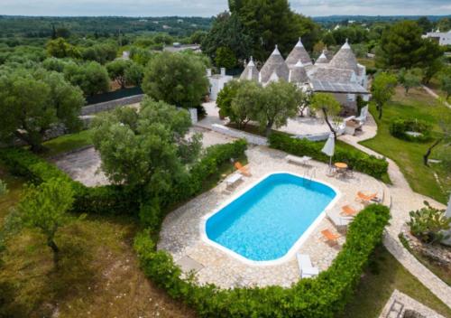 an aerial view of an estate with a swimming pool at Relais Trullo degli Emme in Ostuni