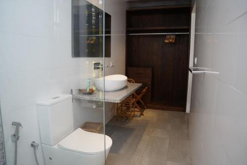a bathroom with a toilet and a sink at Villa Blue Lotus Katunayake in Katunayake