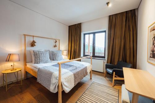 Letto o letti in una camera di Balvanyos Resort - Peakture Hotel & Grand Hotel Balvanyos