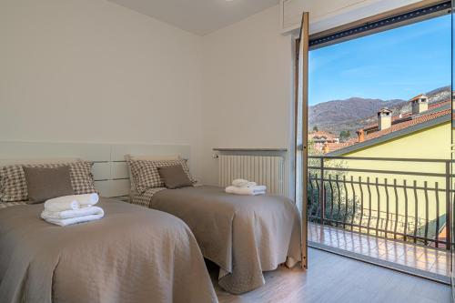 Ένα ή περισσότερα κρεβάτια σε δωμάτιο στο Civico 62 relax vicino al lago