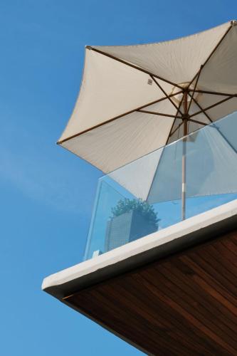 a white umbrella sitting on top of a building at Prinsotel Mal Pas - Adults Only in Alcudia