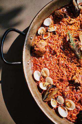 a pan full of food with mushrooms on it at Prinsotel Mal Pas - Adults Only in Alcudia