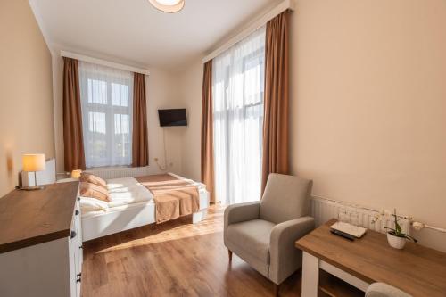 Postel nebo postele na pokoji v ubytování Vila Astoria