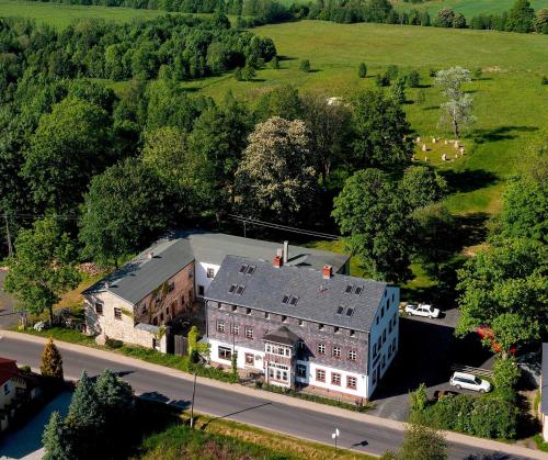 an aerial view of a large building with a house at BioRezydencja in Świeradów-Zdrój