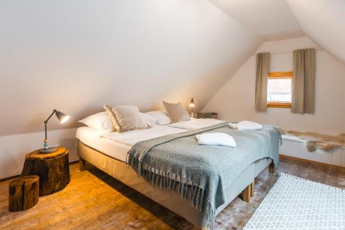 a bedroom with a large bed in a attic at Penzion U náměstí - At the Town Square in Český Krumlov