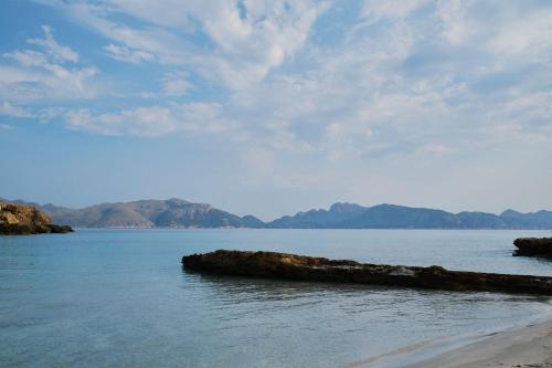 a large body of water with mountains in the background at Prinsotel Mal Pas - Adults Only in Alcudia