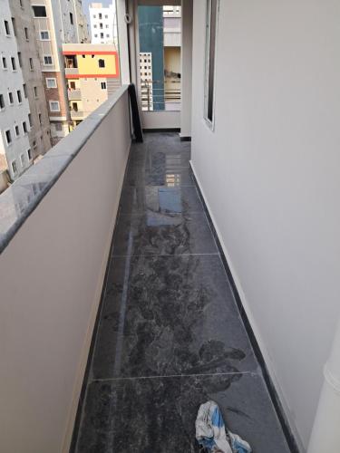 a hallway with a damaged floor in a building at Srinivasa Nilayam in Hyderabad