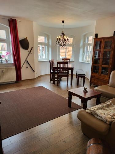 a living room with a couch and a table at Ferienwohnung Detlef Pascher in Kurort Oybin