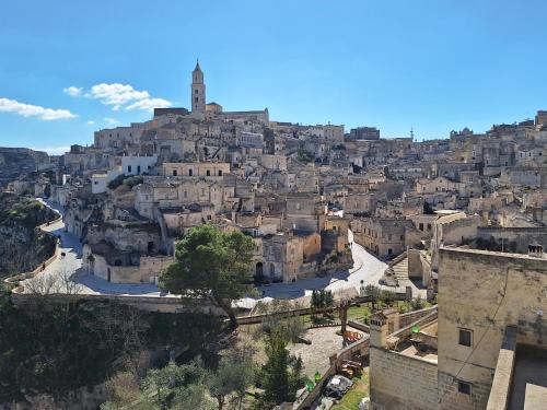 a village on a hill with a city at Arche' Bed and Breakfast in Matera
