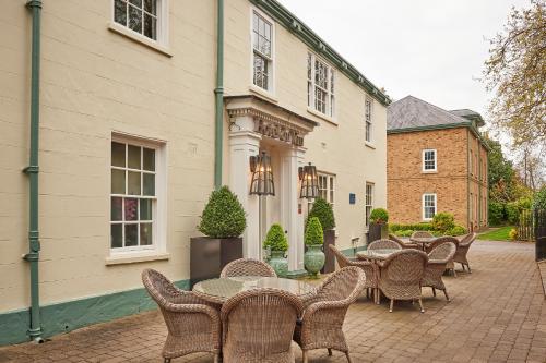 a row of tables and chairs in front of a building at Hotel Du Vin & Bistro York in York