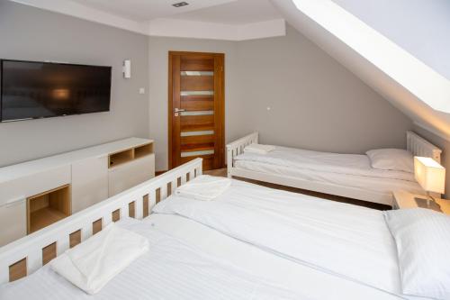Postel nebo postele na pokoji v ubytování Nemo 4 Bedrooms & Grill