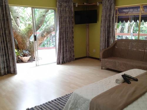 Katil atau katil-katil dalam bilik di NELSPRUIT MHLANGENI GUEST HOUSE