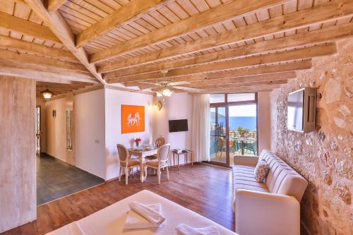 a living room with a couch and a table at Luna Kaş in Kas