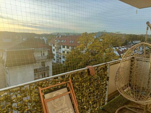 a balcony with a view of a city at Zakrzowek rent in Krakow