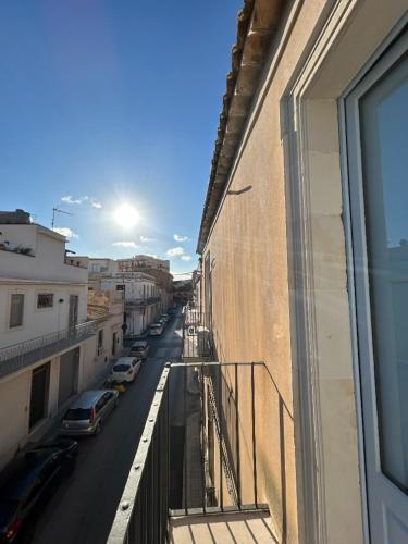 a view of a street from a balcony of a building at Cavour69 in Avola