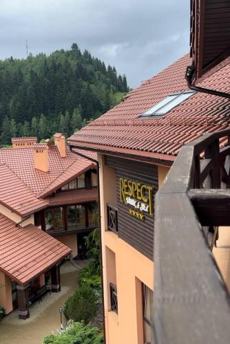 a view of a building with red tile roofs at СПА-Готель "RESPECT" in Skhidnitsa