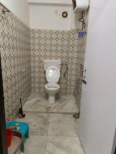a bathroom with a toilet and a sink at Shanti homestay in Temi