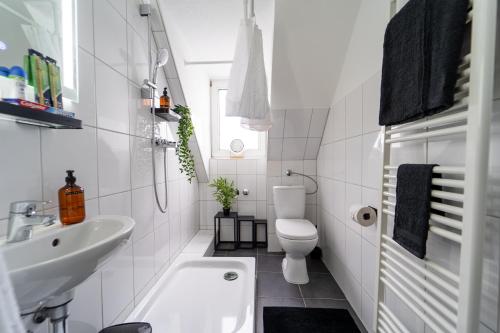 Ett badrum på Im Stadtzentrum / Küche / Für 5