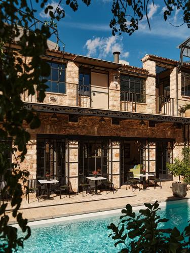 a house with a pool in front of it at Not Boutique Hotel in Athens
