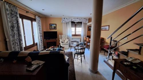 a living room with a couch and a table at La Madre Abadesa, Casa en Casco Historico in Tordesillas
