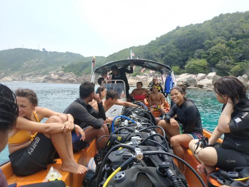 a group of people on a boat in the water at Perhentian Idaman in Perhentian Island