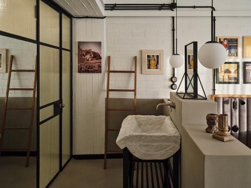 a room with a sink and a counter with a stool at Not Boutique Hotel in Athens