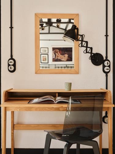 a desk with a mirror and a table with a chair at Not Boutique Hotel in Athens