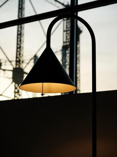 a lamp hanging from a pole in front of a building at Not Boutique Hotel in Athens