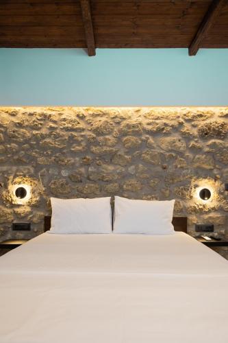 Ένα ή περισσότερα κρεβάτια σε δωμάτιο στο Stone Manor