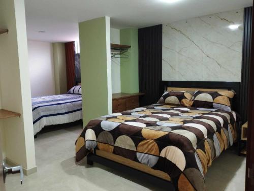 Ένα ή περισσότερα κρεβάτια σε δωμάτιο στο Hotel Colonial House